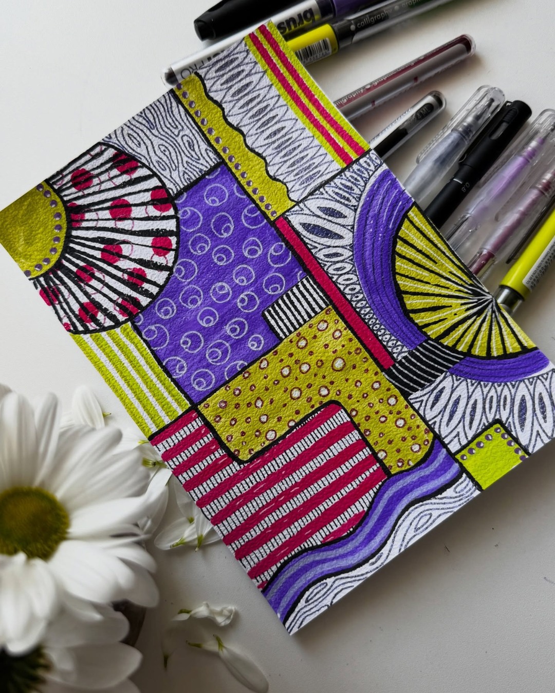 🎨✨ A Vibrant Fusion of Bold Colors and Intricate Patterns ✨🎨

This striking artwork by taya.penart combines bold geometric shapes, intricate hand-drawn patterns, and a vibrant palette of purple, hot pink, and electric lime green. Black-and-white details, including spirals, stripes, dots, and wavy lines, create eye-catching contrast and visual rhythm. Thick black outlines bring each section to life, transforming simple shapes into a playful, dynamic, and beautifully balanced patchwork of patterns. 💜💗💚

Why this artwork stands out:

1️⃣ Bold color palette — vibrant purple, hot pink, and lime green create a striking contrast against the black-and-white details.

2️⃣ Geometric patchwork — a variety of shapes and divided sections come together to form a dynamic, well-balanced composition.

3️⃣ Intricate pattern work — spirals, dots, stripes, loops, and wavy lines make every section unique and engaging.

4️⃣ Strong outlines and contrast — crisp black linework separates the colorful elements and gives the design a distinctive graphic style.

5️⃣ Creative visual rhythm — the repetition of patterns and the interplay of straight lines and curves keep the eye moving across the entire artwork.

This piece is a wonderful celebration of pattern drawing, creative experimentation, and the beauty of combining simple shapes into something extraordinary. Every section offers a new detail to discover! 🌈🖊️

Art by: taya.penart 🤍

#DoodleArt #PatternArt #ZentangleArt #GeometricArt #ColorfulArt #AbstractArt #HandDrawnArt #PatternDrawing #DoodleArtClub #CreativePatterns #LineArt #MarkerArt #MindfulArt #SketchbookArt #ArtInspiration #ArtCommunity #ContemporaryDoodle #ColorfulPatterns