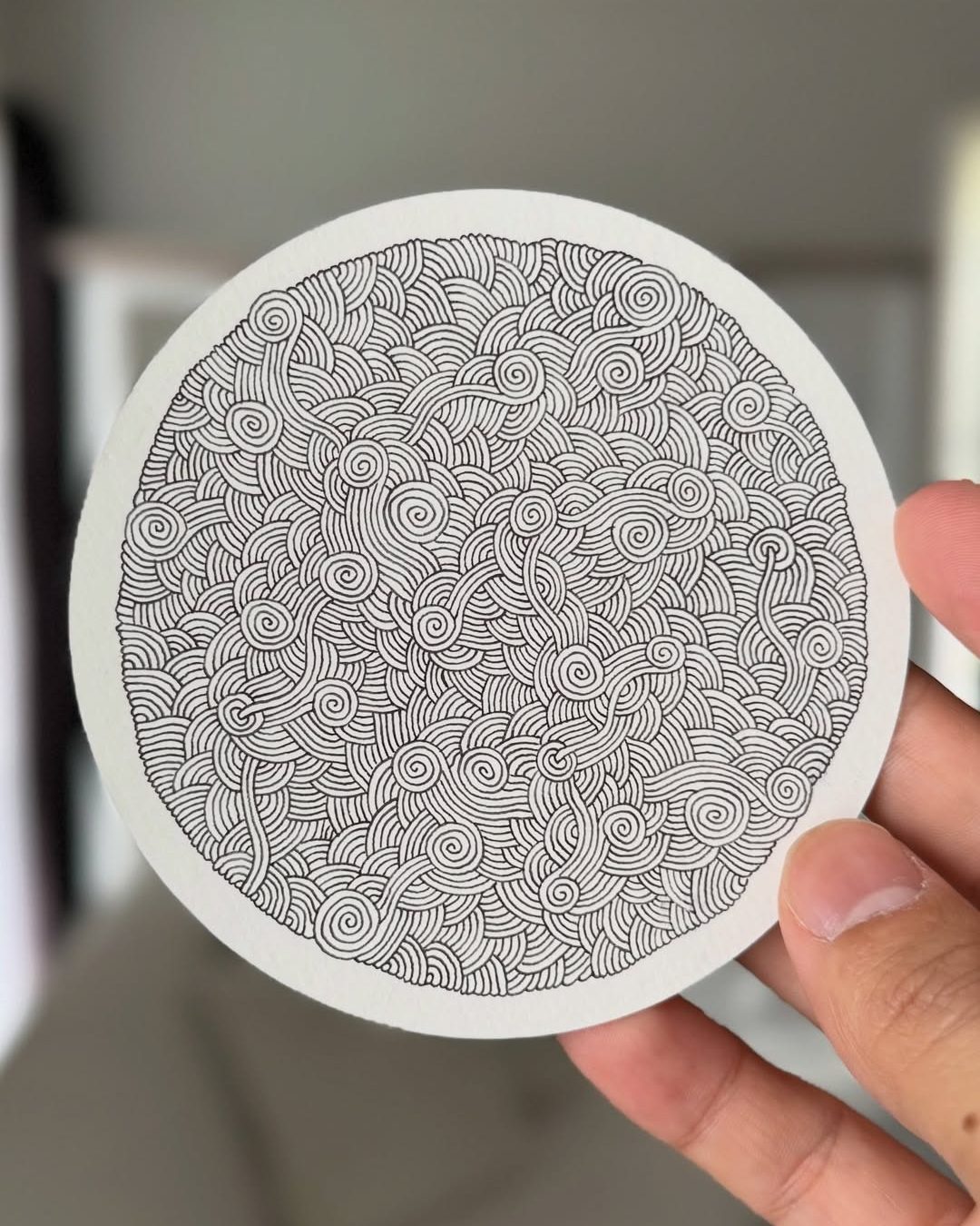 🌀✨ Endless Lines, Infinite Flow ✨🌀

This mesmerizing piece by @danilorreyesart proves how a single repeating line can transform into something beautifully complex. Countless flowing curves and spirals intertwine across the circular composition, creating a hypnotic rhythm that invites the eye to wander without ever finding a beginning or an end. The monochrome palette keeps the focus entirely on movement, texture, and precision. 🖊️

Why this artwork stands out:

1️⃣ Intricate continuous linework — stunning patience and control
2️⃣ Organic spiral forms — creates a natural flowing rhythm
3️⃣ Monochrome elegance — simple yet visually powerful
4️⃣ Dense pattern texture — rewarding to explore up close
5️⃣ Meditative visual energy — calming, immersive, and timeless

Art by: @danilorreyesart 🤍

#ZentangleArt #LineArt #PatternArt #InkDrawing #MonochromeArt #AbstractArt #MindfulDrawing #DoodleArt #CreativePatterns #PenAndInk #ArtInspiration #HandDrawnArt #SlowArt #MeditativeArt #ArtistSpotlight