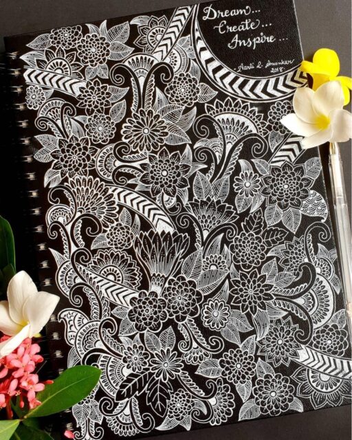 🌿🤍 A Symphony of Florals and Patterns 🤍🌿

This breathtaking artwork by @aarti_amonkar transforms a simple notebook cover into a masterpiece of intricate floral design. Delicate blooms, flowing paisley motifs, and ornamental patterns weave seamlessly across the dark background, creating a striking contrast that immediately captures attention. The use of white ink gives every detail a luminous quality, making the composition feel both elegant and timeless. ✨

Every section reveals new textures and decorative elements, inviting the viewer to slow down and appreciate the incredible craftsmanship behind each carefully drawn line.

Why this artwork stands out:

1️⃣ Stunning white-on-black contrast — bold, elegant, and eye-catching
2️⃣ Intricate floral details — rich with texture and precision
3️⃣ Flowing paisley elements — creates movement throughout the design
4️⃣ Dense decorative patterns — every corner offers something new to discover
5️⃣ Inspiring visual harmony — beautifully balances complexity and elegance

Art by: @aarti_amonkar 🤍

#FloralArt #WhiteInkArt #PatternArt #PaisleyArt #DoodleArt #BlackAndWhiteArt #HandDrawnArt #InkDrawing #ArtInspiration #CreativePatterns #SketchbookArt #MandalaInspired #DetailedArt #PenAndInk #ArtCommunity