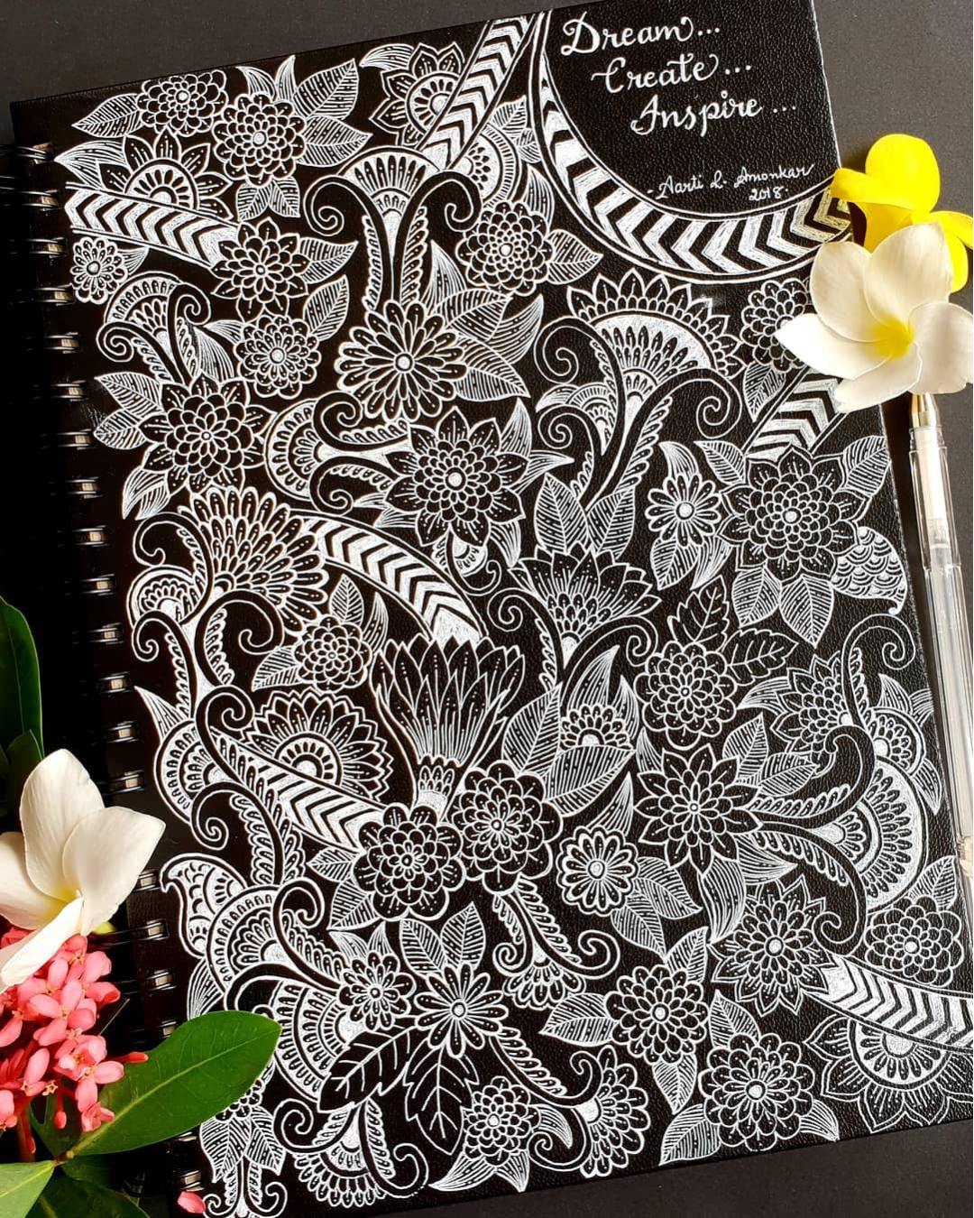 🌿🤍 A Symphony of Florals and Patterns 🤍🌿

This breathtaking artwork by @aarti_amonkar transforms a simple notebook cover into a masterpiece of intricate floral design. Delicate blooms, flowing paisley motifs, and ornamental patterns weave seamlessly across the dark background, creating a striking contrast that immediately captures attention. The use of white ink gives every detail a luminous quality, making the composition feel both elegant and timeless. ✨

Every section reveals new textures and decorative elements, inviting the viewer to slow down and appreciate the incredible craftsmanship behind each carefully drawn line.

Why this artwork stands out:

1️⃣ Stunning white-on-black contrast — bold, elegant, and eye-catching
2️⃣ Intricate floral details — rich with texture and precision
3️⃣ Flowing paisley elements — creates movement throughout the design
4️⃣ Dense decorative patterns — every corner offers something new to discover
5️⃣ Inspiring visual harmony — beautifully balances complexity and elegance

Art by: @aarti_amonkar 🤍

#FloralArt #WhiteInkArt #PatternArt #PaisleyArt #DoodleArt #BlackAndWhiteArt #HandDrawnArt #InkDrawing #ArtInspiration #CreativePatterns #SketchbookArt #MandalaInspired #DetailedArt #PenAndInk #ArtCommunity