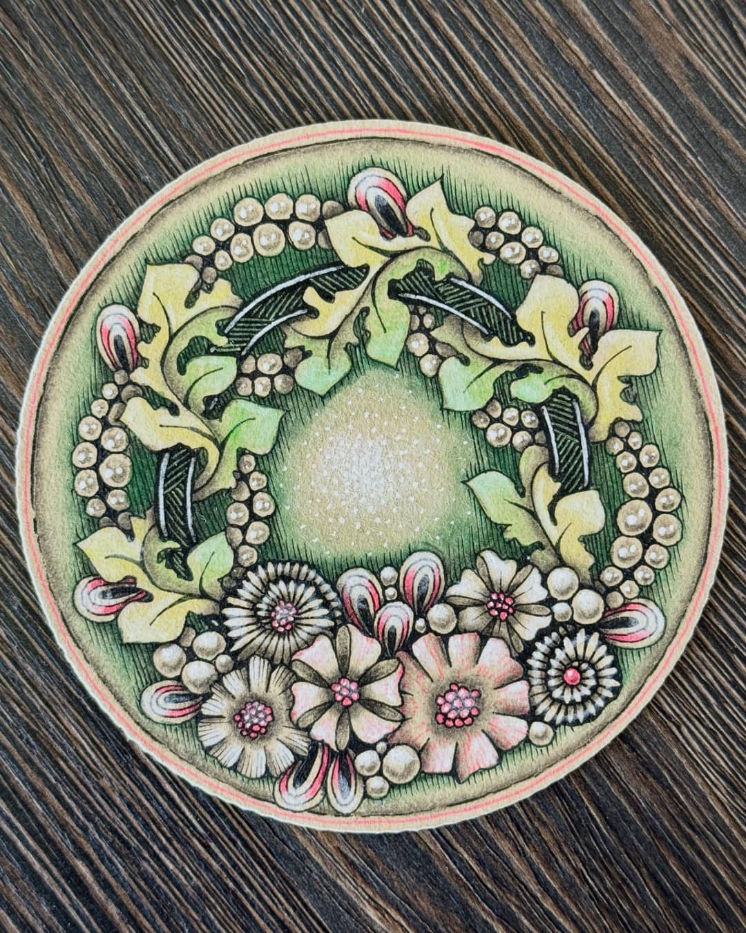 🌿🌸 A Garden of Delicate Details 🌸🌿

This beautiful artwork by @zen.linea brings together botanical elements, intricate patterns, and soft vintage-inspired colors in a wonderfully balanced circular composition. Delicate leaves, berries, and flowers form a natural wreath around the softly textured center, while fine linework and subtle shading give each element a handmade, dimensional quality. ✨

The gentle combination of greens, creams, pinks, and earthy tones creates a peaceful atmosphere, making this piece feel like a tiny garden captured inside a circle.

Why this artwork stands out:

1️⃣ Botanical composition — flowers, leaves, and berries blend beautifully together
2️⃣ Intricate linework — fine details give every element its own character
3️⃣ Soft natural palette — calming greens and delicate pinks create harmony
4️⃣ Circular balance — the wreath-like arrangement feels complete and cohesive
5️⃣ Textured shading — subtle details add depth and a beautiful handmade feel

Art by: @zen.linea 🤍

#BotanicalArt #FloralArt #PatternArt #LineArt #NatureInspired #DoodleArt #HandDrawnArt #InkDrawing #SketchbookArt #ArtInspiration #FloralIllustration #MindfulArt #CreativePatterns #DecorativeArt #ArtCommunity